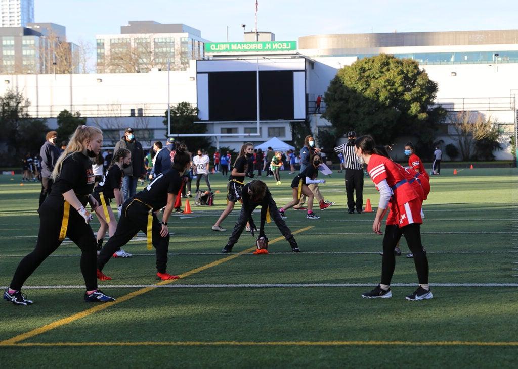 photo of two teams facing off on a football field