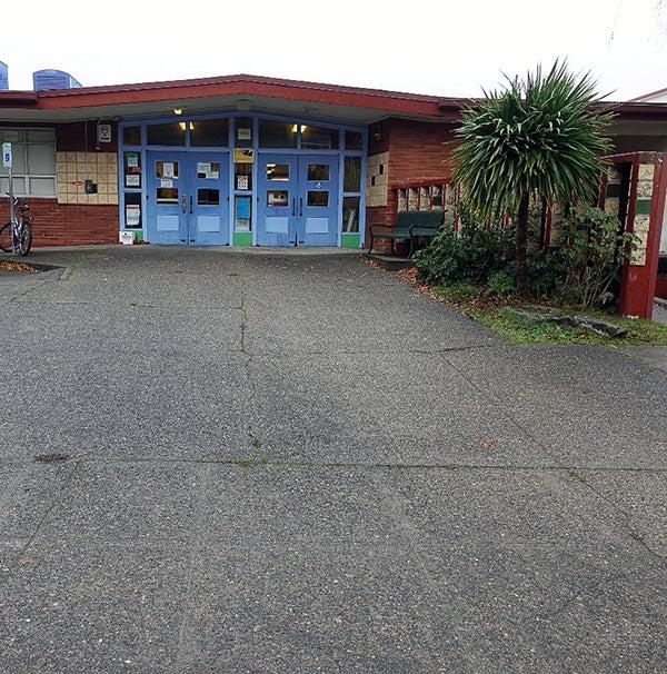 blue doors in a low brick building