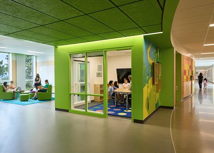 a green pullout area for small group learning next to a learning commons