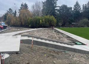 concrete stairs with soil on each side