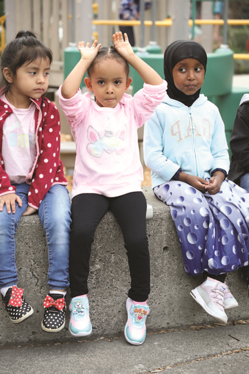 Preschool students outside at recess