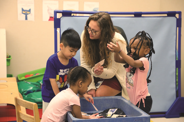 Preschool students and teacher